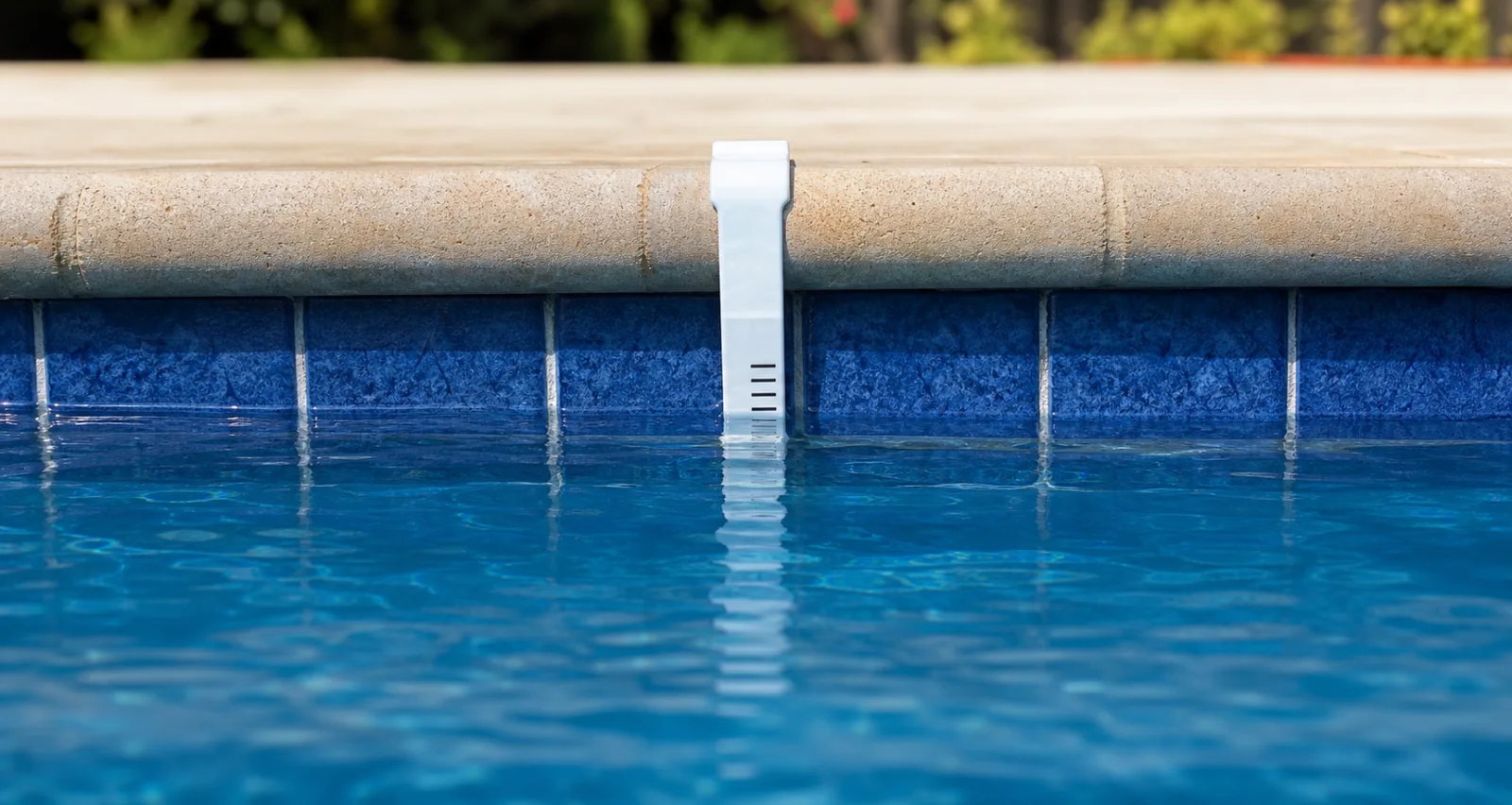 Illustrative close view of a pool waterline and tile